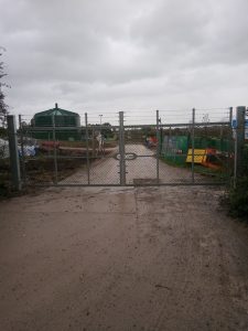 pair of steel and chain link gates with a 6m span 1
