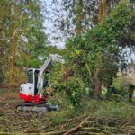 Takeuchi moving brash and stacking ready for chipping